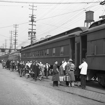 Mass evacuation of Japanese Americans from Bainbridge Island, Seattle, Washington, 30th March 1942 boarding trains under wartime presidential Executive Order 9066.