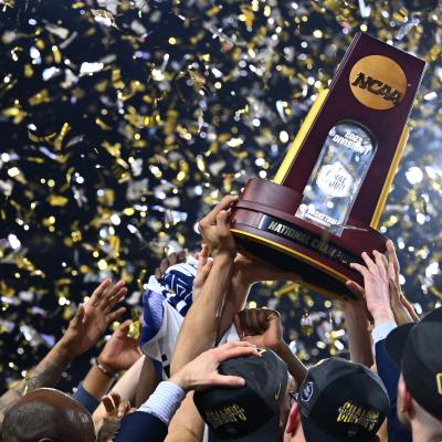 The Connecticut Huskies celebrate with the NCAA National Championship trophy.