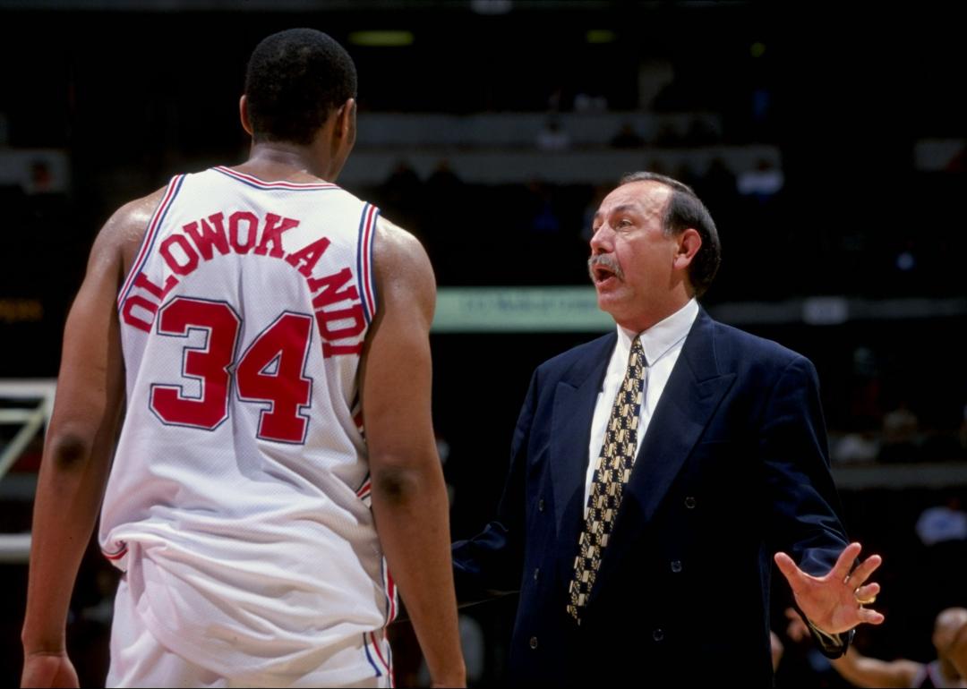 Los Angeles Clippers head coach Chris Ford talks to Michael Olowokandi during a game.