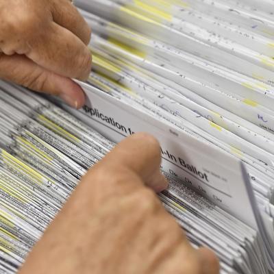 Donna Blatt, the Chief Registrar with the applications for mail-in ballots they have received at the Berks County Office of Election Services in the Berks County Services Building in Reading, PA 