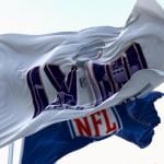 Super Bowl and NFL flags flying in the wind