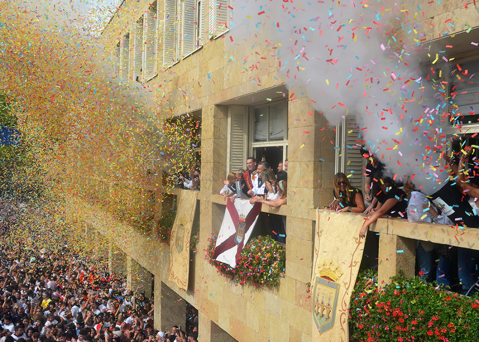 People on a balcony of the Logroño City Hall at the festival kick off.